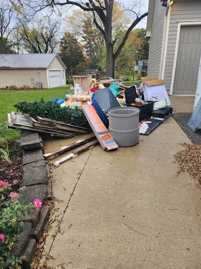Dumpster being loaded with debris for 3 Yard Dumpster Rental in Sierra Ridge